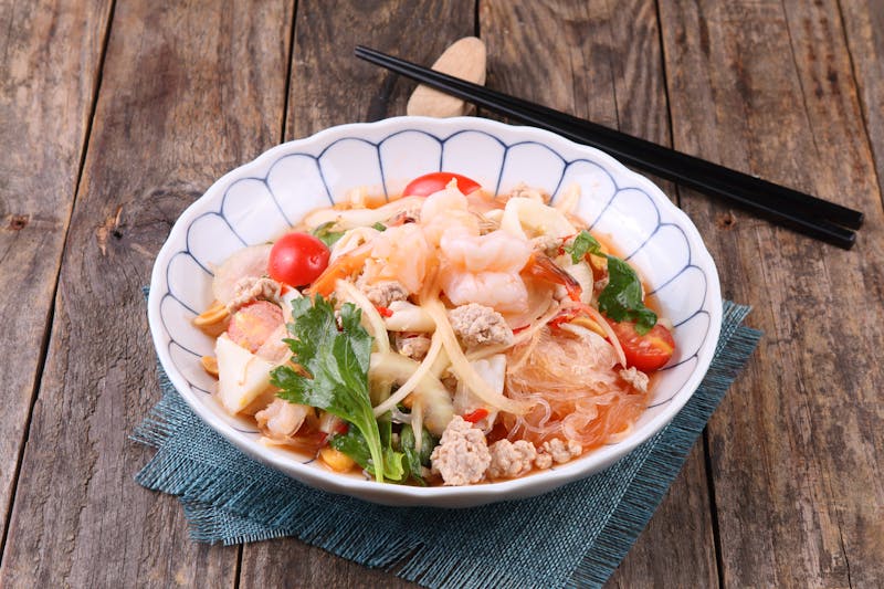 Spicy Thai Noodle Bowl with colorful garnishes